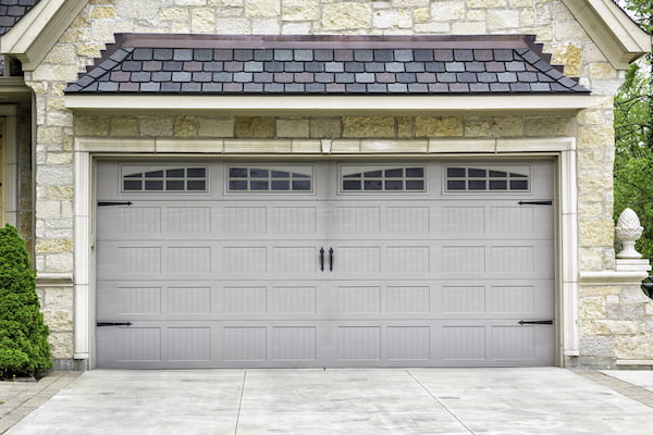 Carriage house door with decorative hardware Carriage house door with decorative hardware